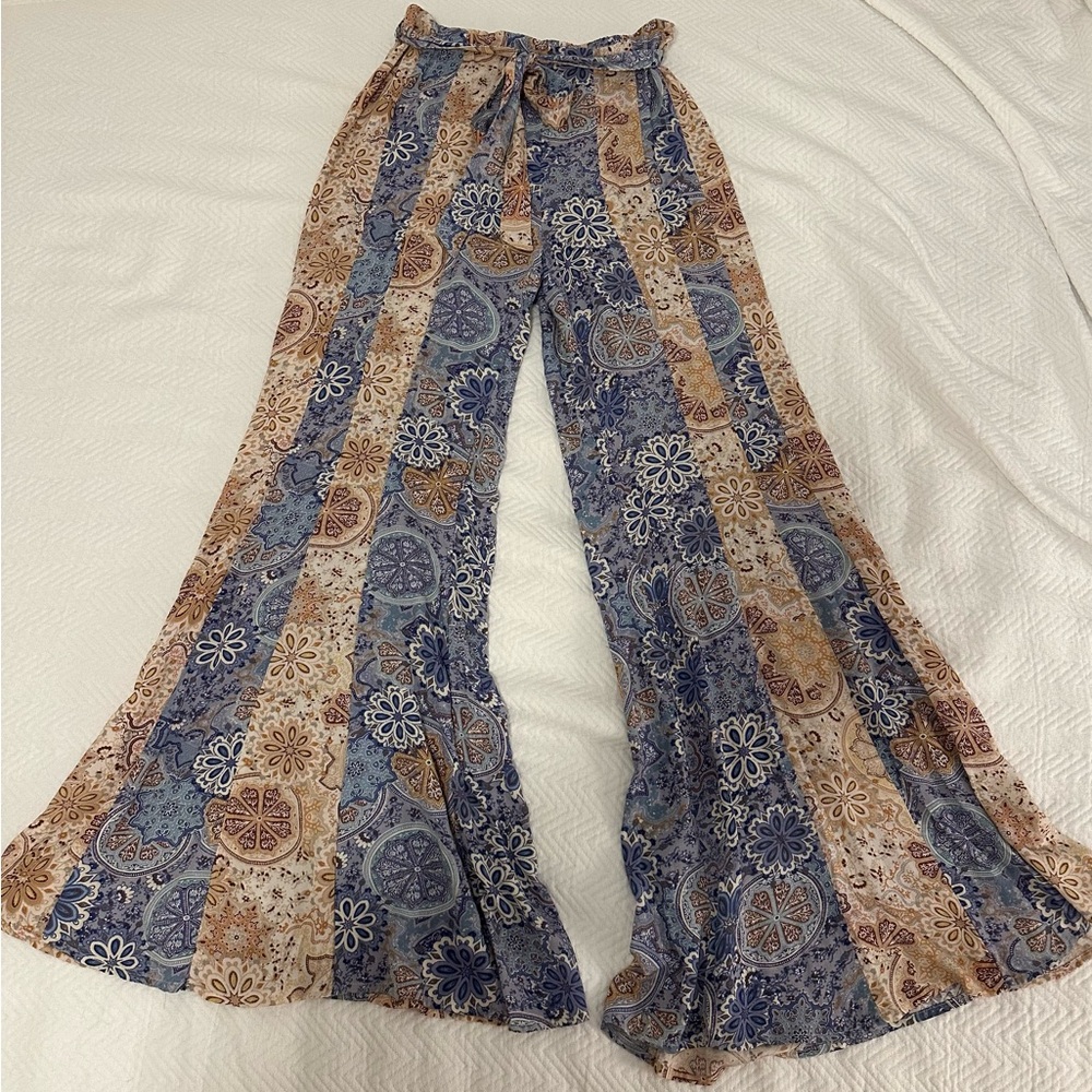 comfy hippie style pants with elastic waistband in the back and a fabric “belt”